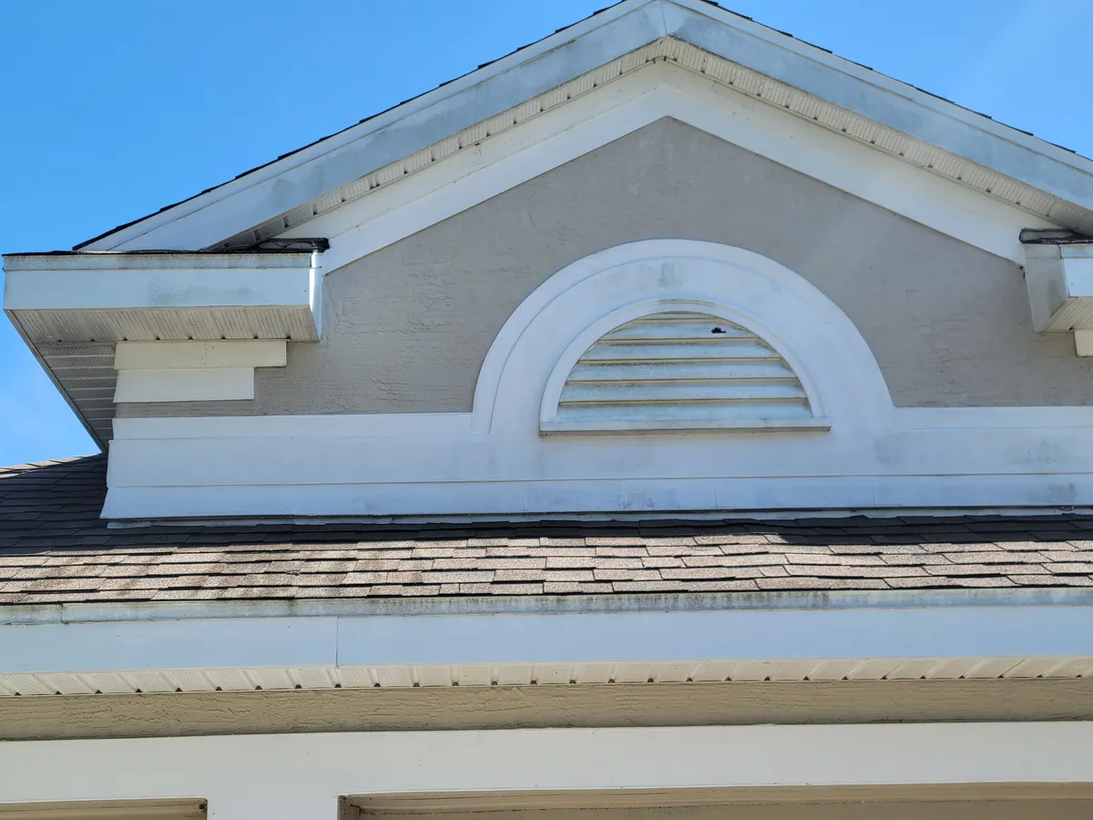 Before: Full exterior soft wash on a two-story home. Algae and mildew buildup gone.