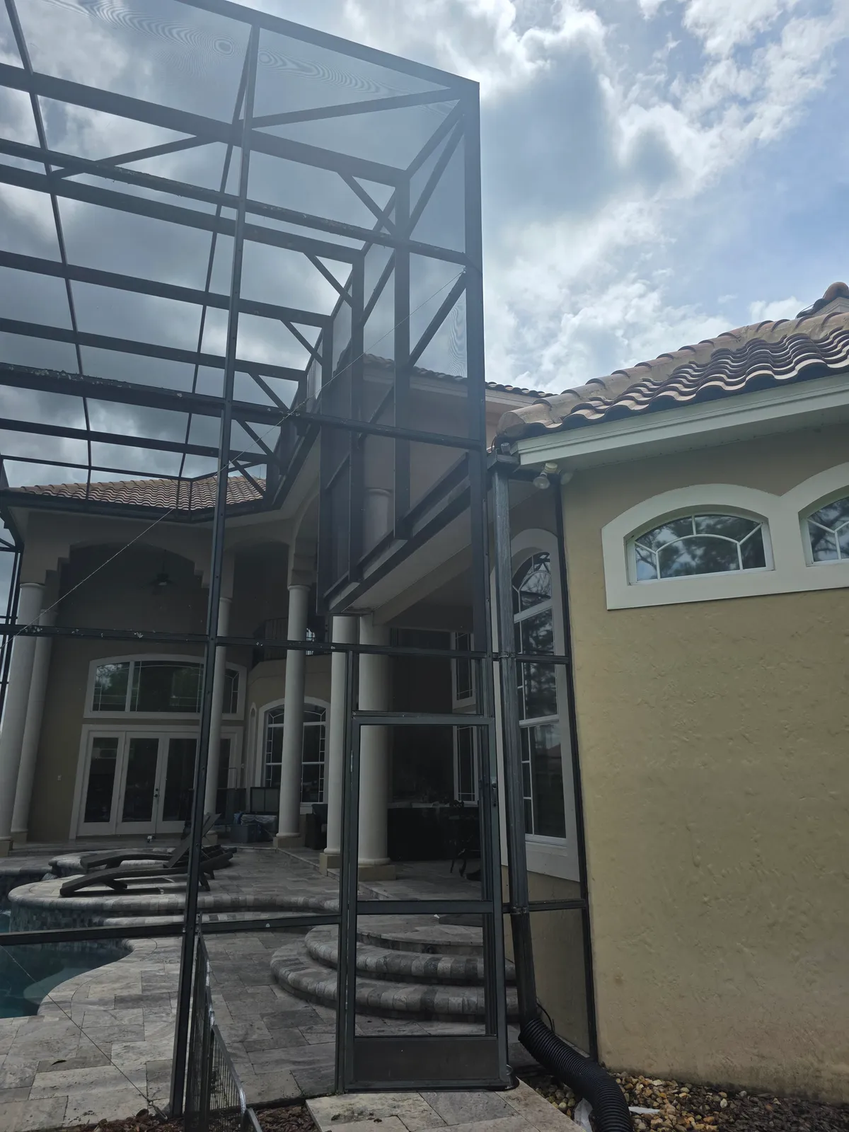 Before: Every screen panel and aluminum frame scrubbed clean. Pool area looks new again.