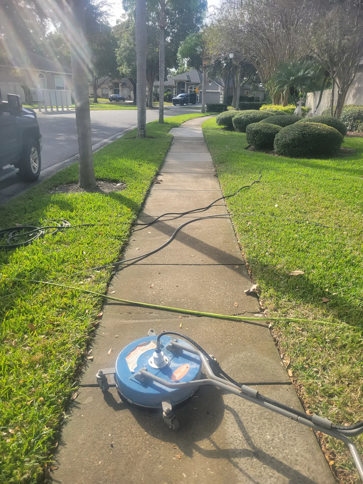 Before: Neighborhood sidewalk cleaned with a surface cleaner for an even finish.