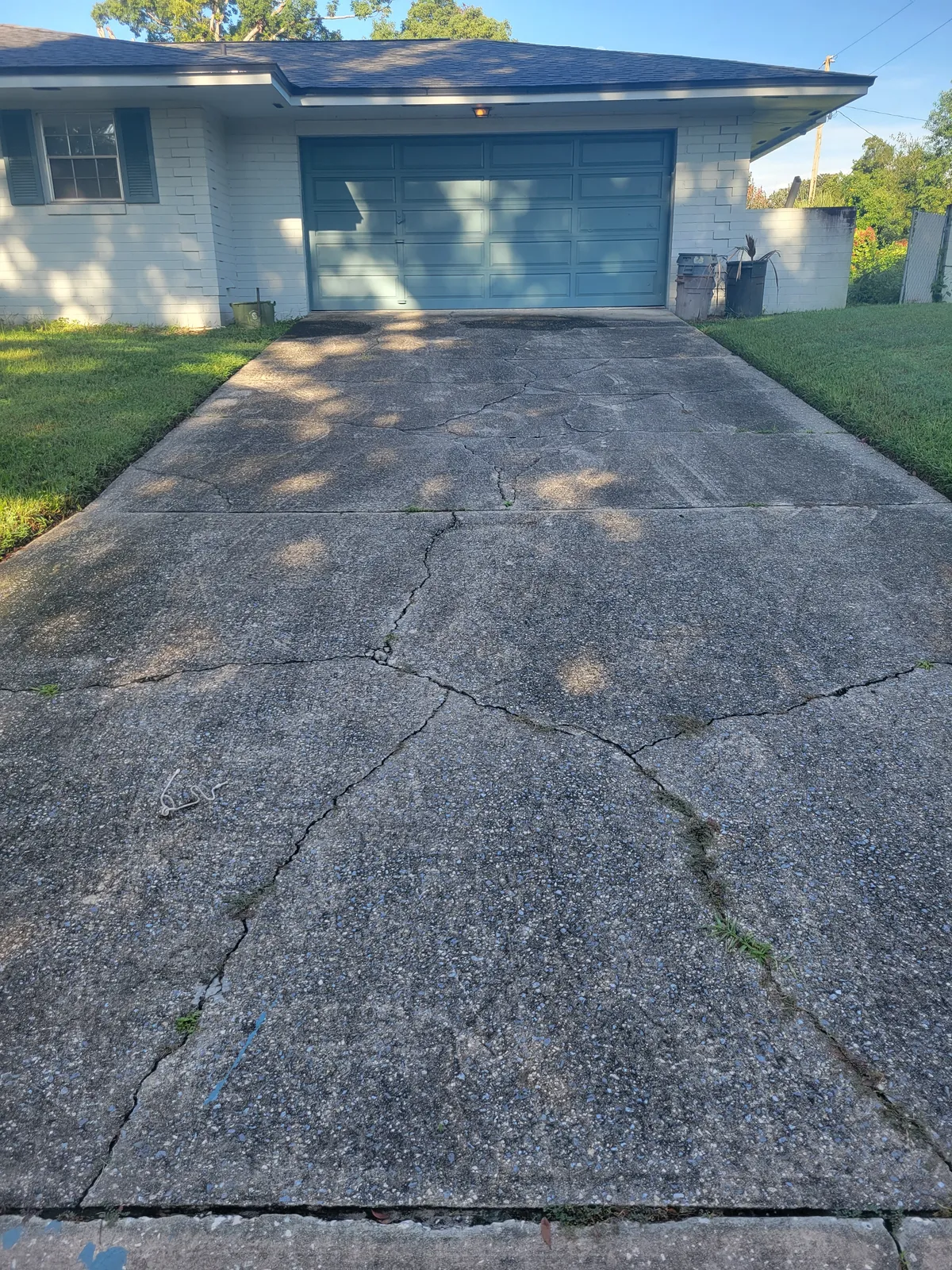 Dirty driveway before pressure washing